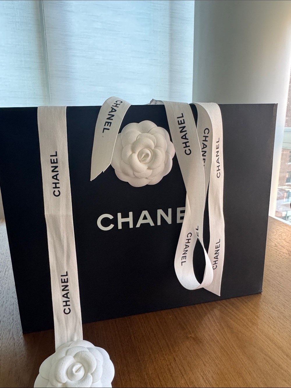 Authentic 100% CHANEL White Ribbon and black gift bag.